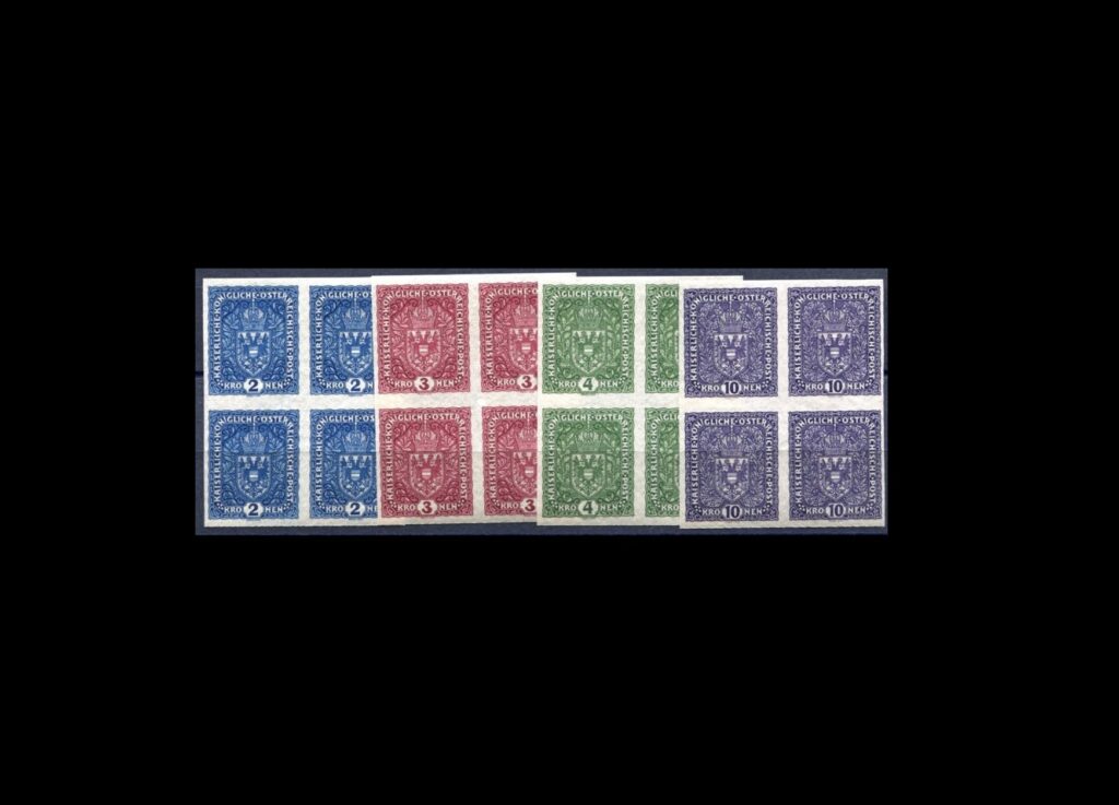 Czechoslovakia I – Preliminary / Concurrent Issues – Imperforate Blocks of 4 with Large Light Overprints, 1917, ex Wiener Post Archive. The definitive perforated versions are considered the first Czechoslovak stamps, as they became property of the Czechoslovak state after October 28, 1918, and remained valid until the issuance of the Hradčany stamps on December 18, 1918 – and even thereafter.